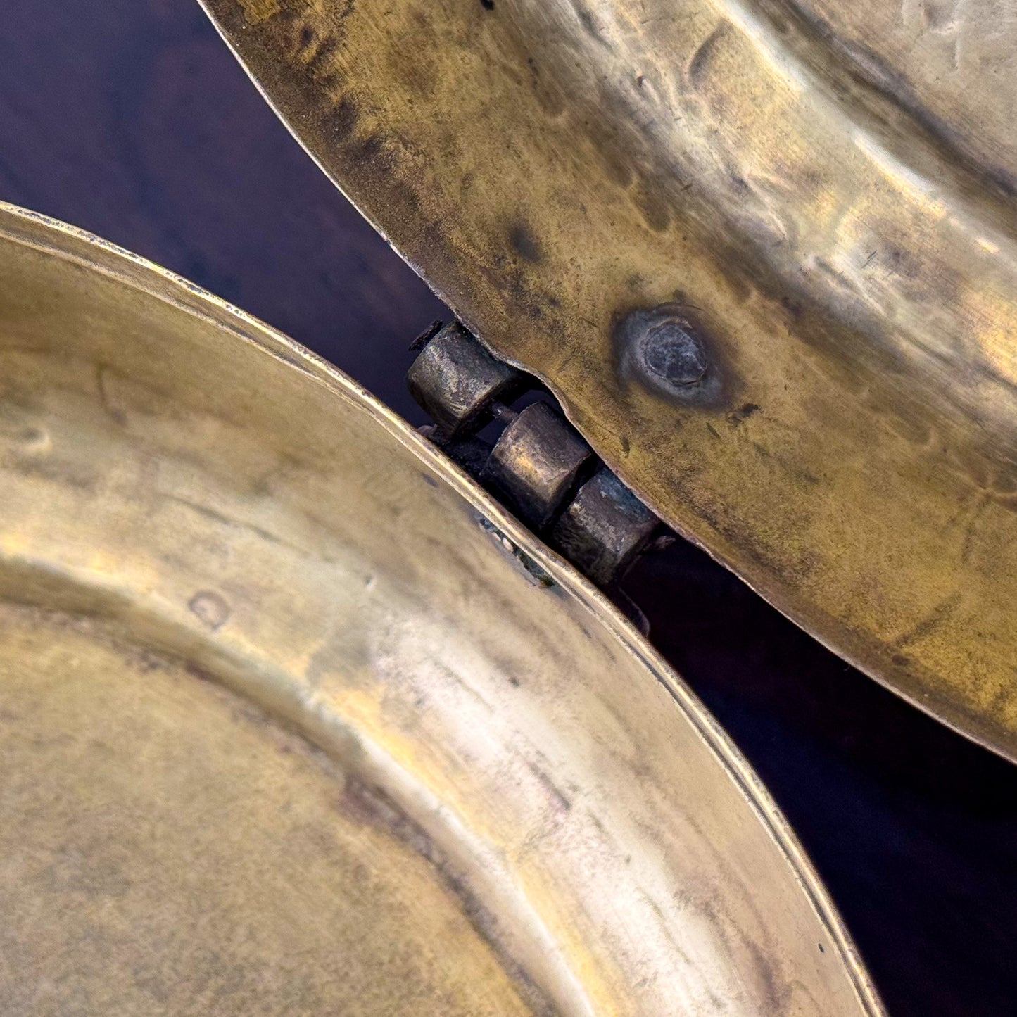 Close-up of two metallic objects with a dark background