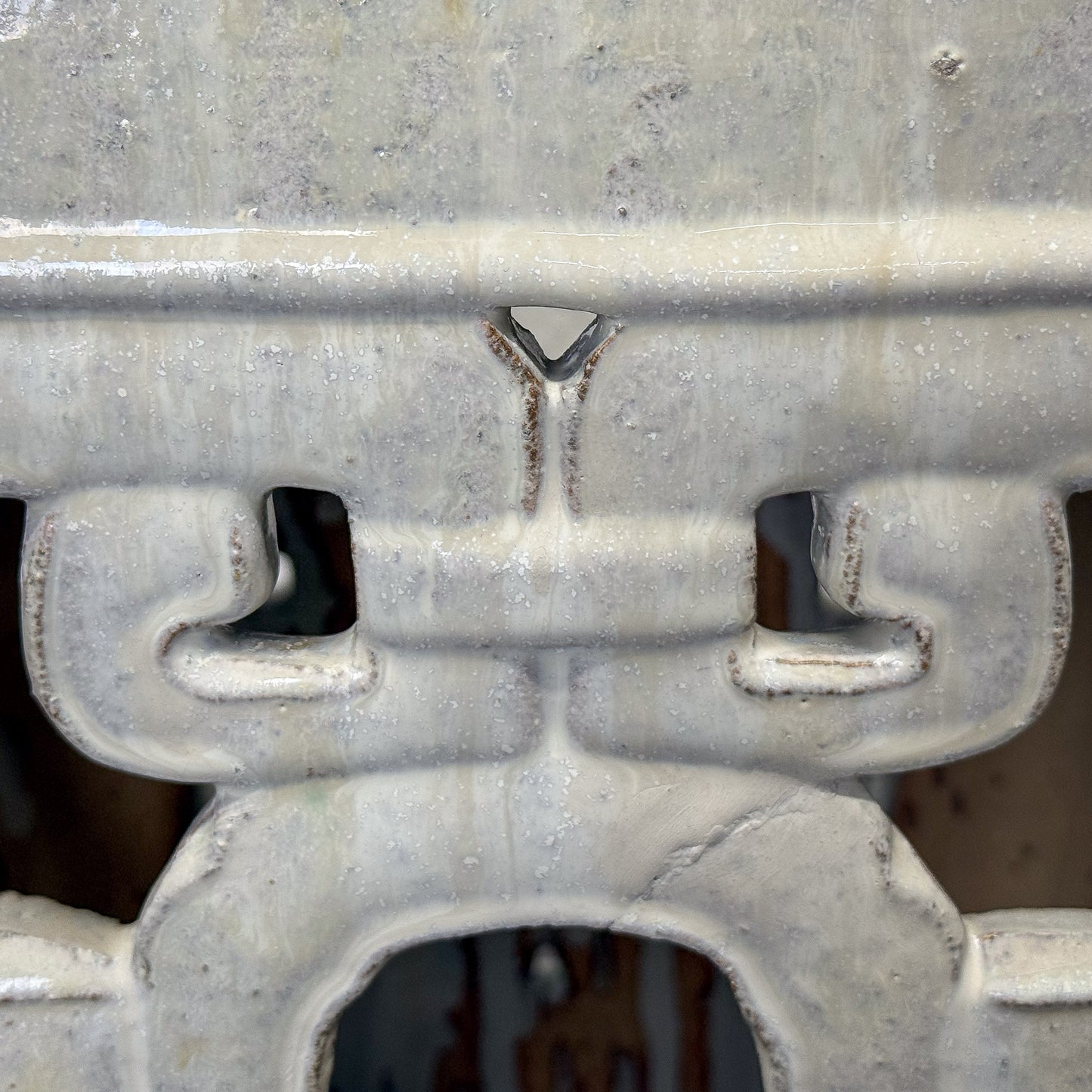 Close-up of a metal bracket with a textured surface