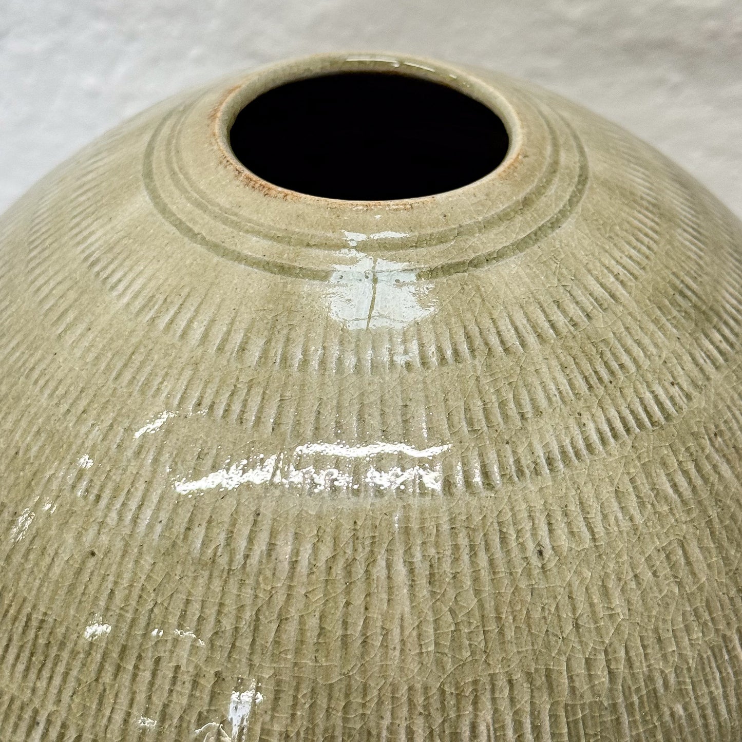 Textured ceramic vase on a neutral background