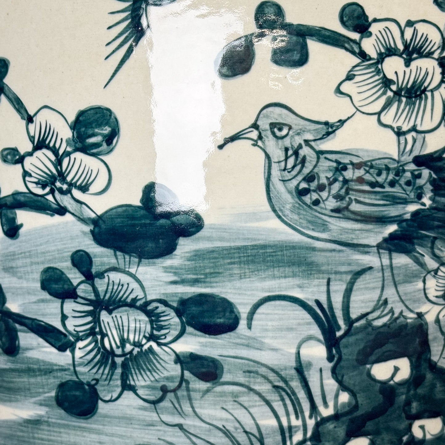 Traditional Chinese ink painting of a bird and flowers on a textured beige background