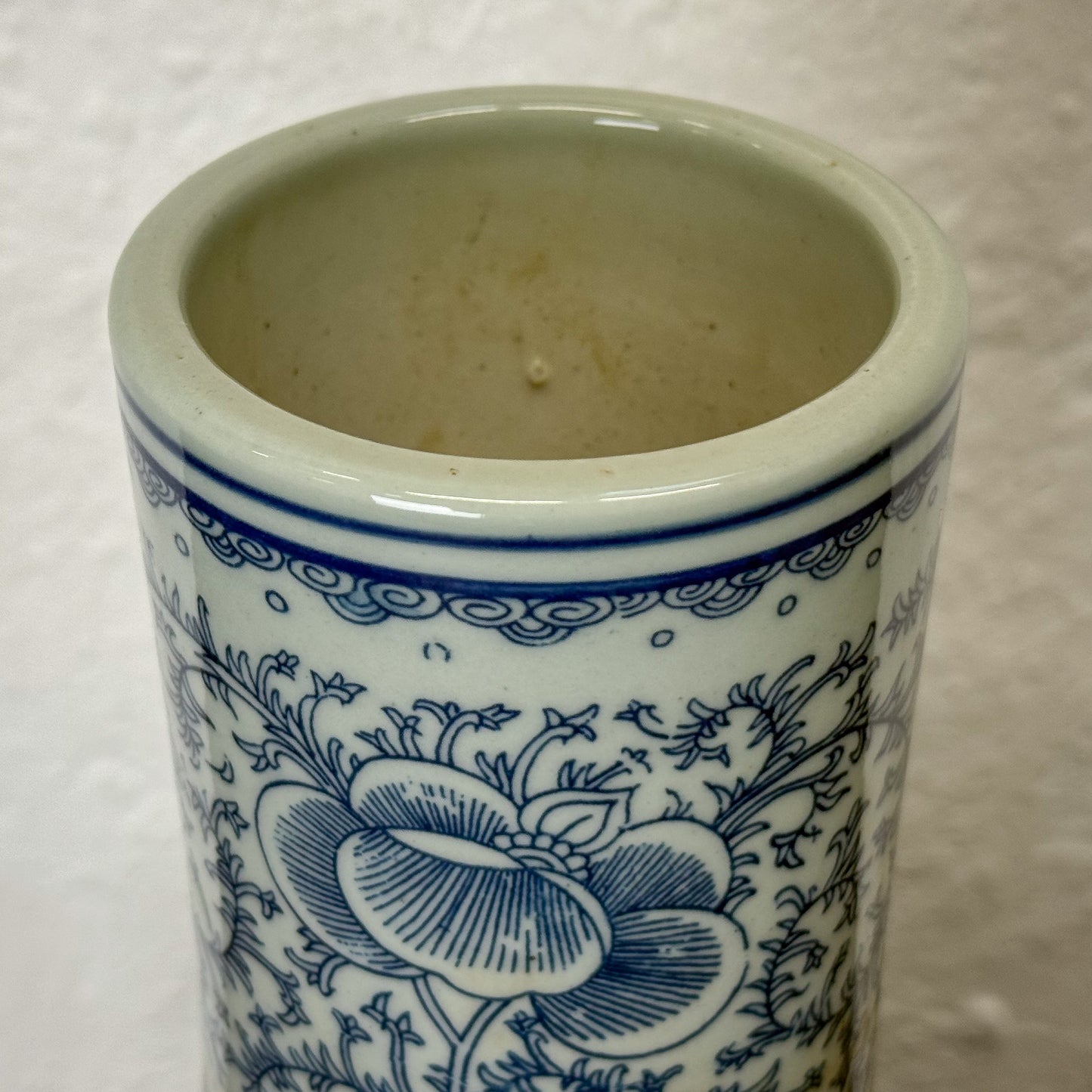 Ceramic vase with blue floral patterns on a white background