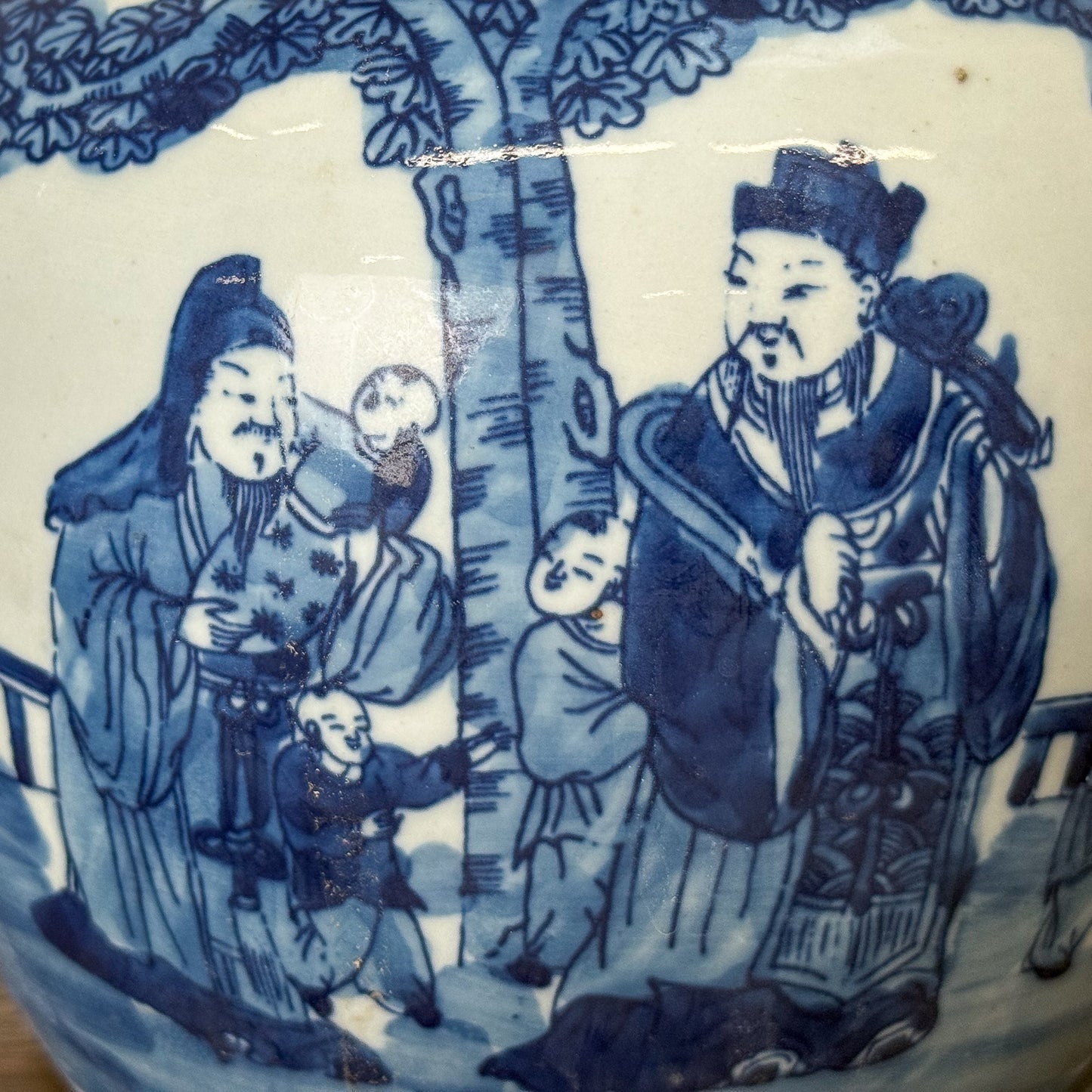 Blue and white ceramic dish with traditional Chinese scene