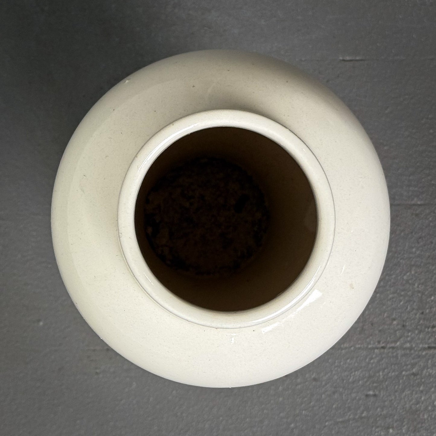White ceramic jar on a gray background