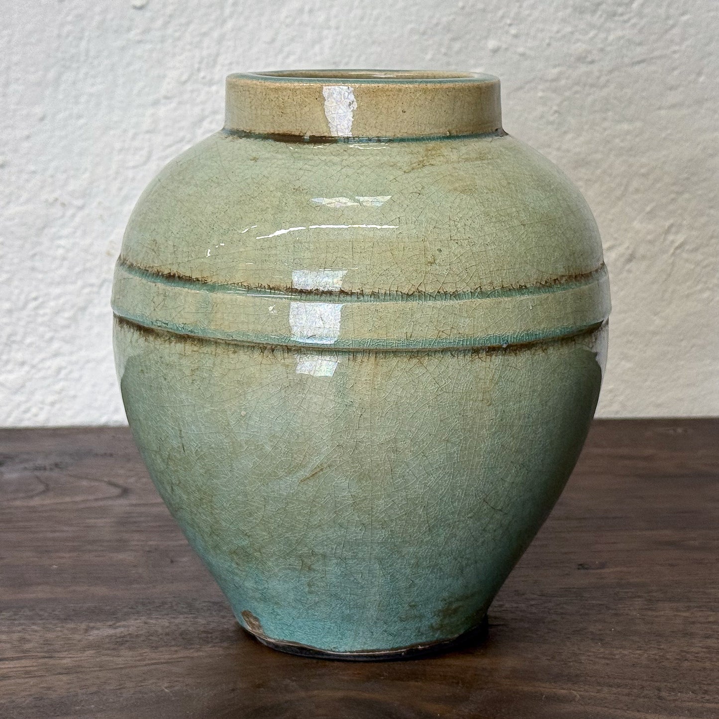 Close-up of a ceramic jar with a textured surface and visible glaze.
