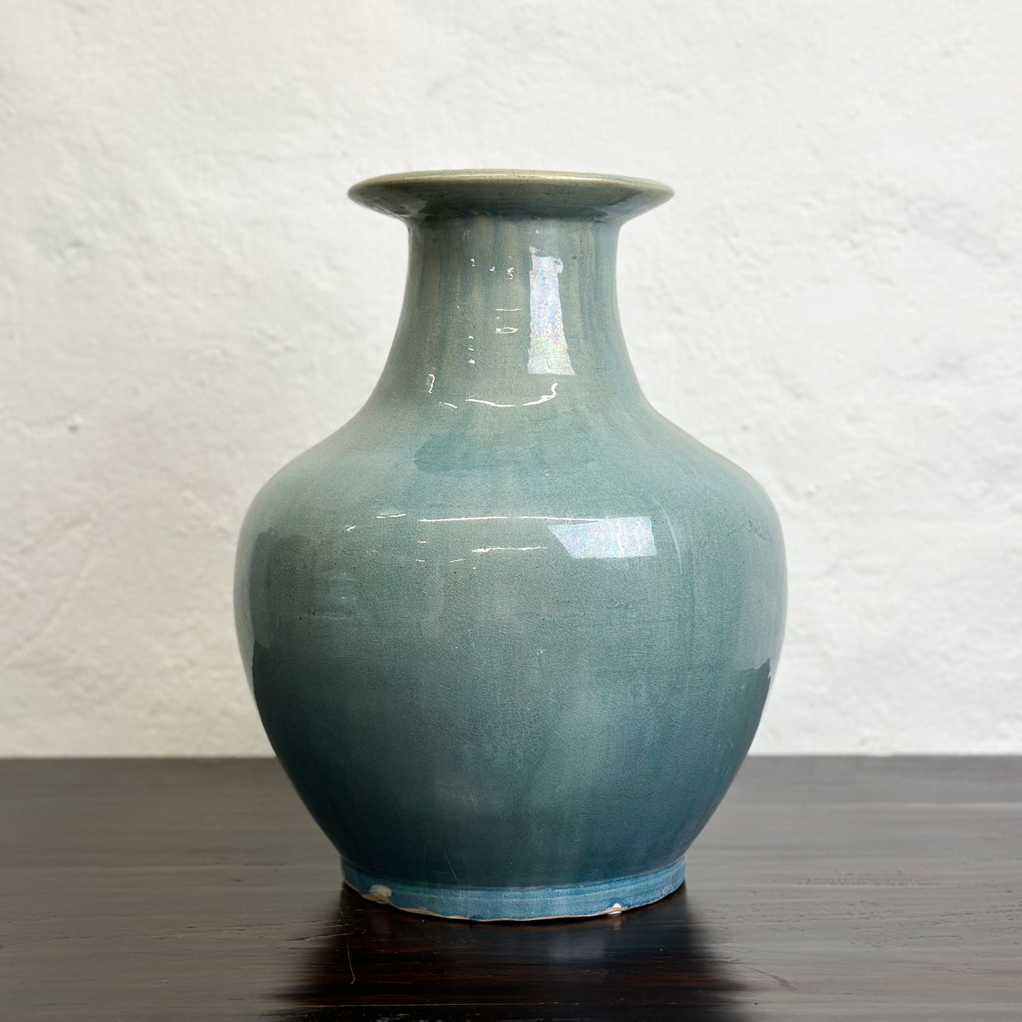 A bulb-shaped Chinese ceramic vase with a sea green glaze, displayed against a neutral background.