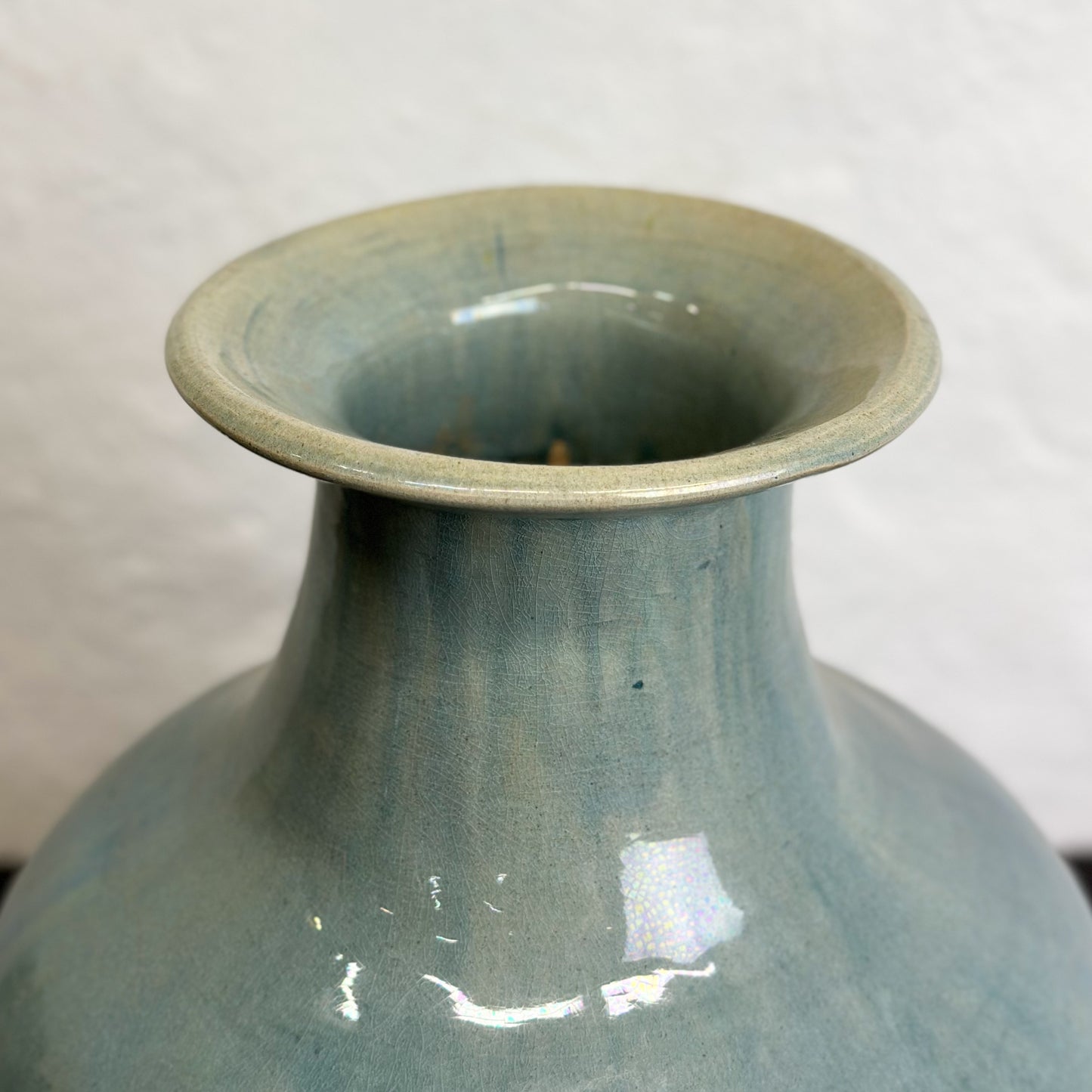 A bulb-shaped Chinese ceramic vase with a sea green glaze, displayed against a neutral background.