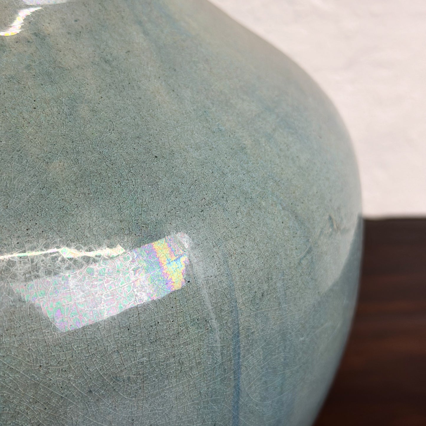 A bulb-shaped Chinese ceramic vase with a sea green glaze, displayed against a neutral background.
