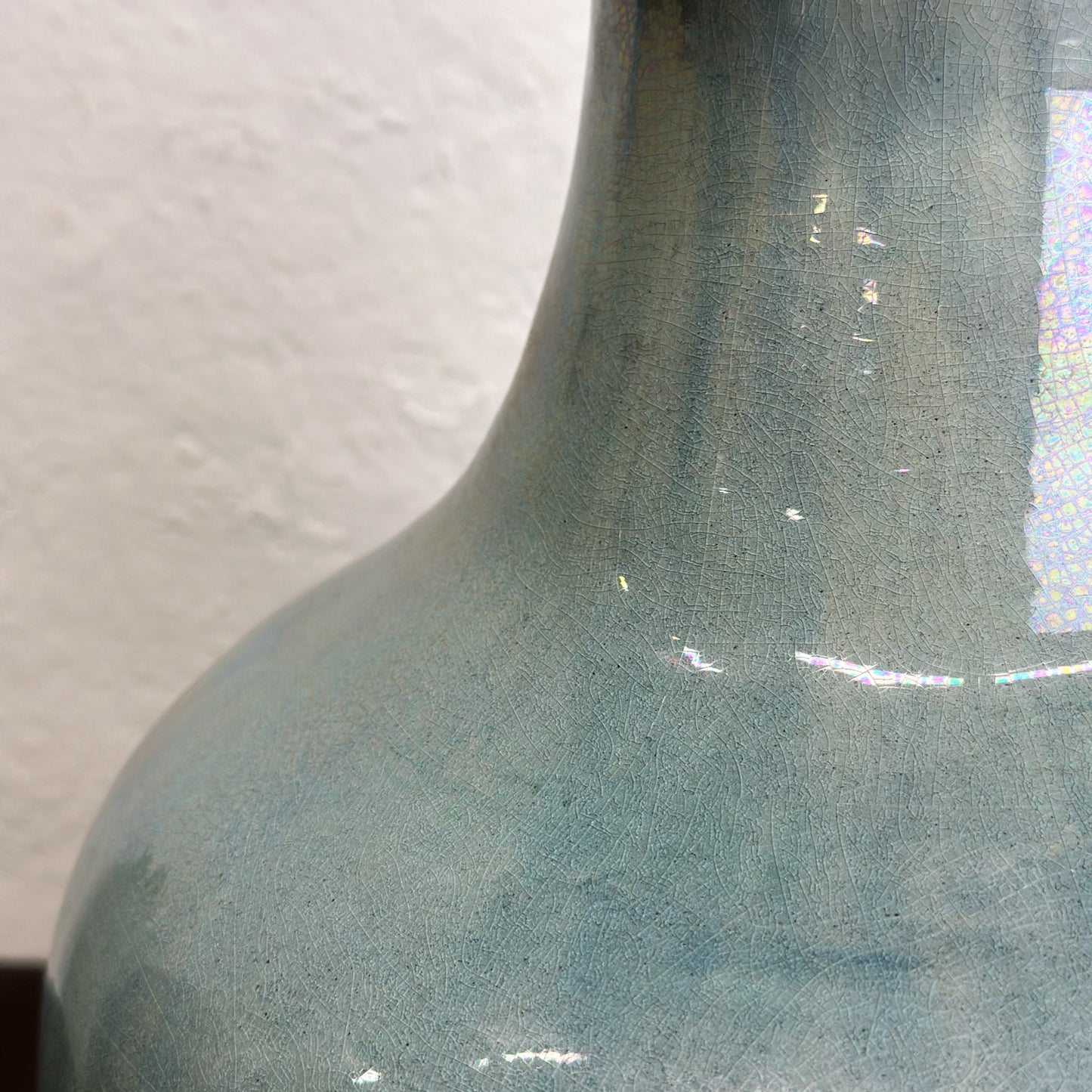 A bulb-shaped Chinese ceramic vase with a sea green glaze, displayed against a neutral background.