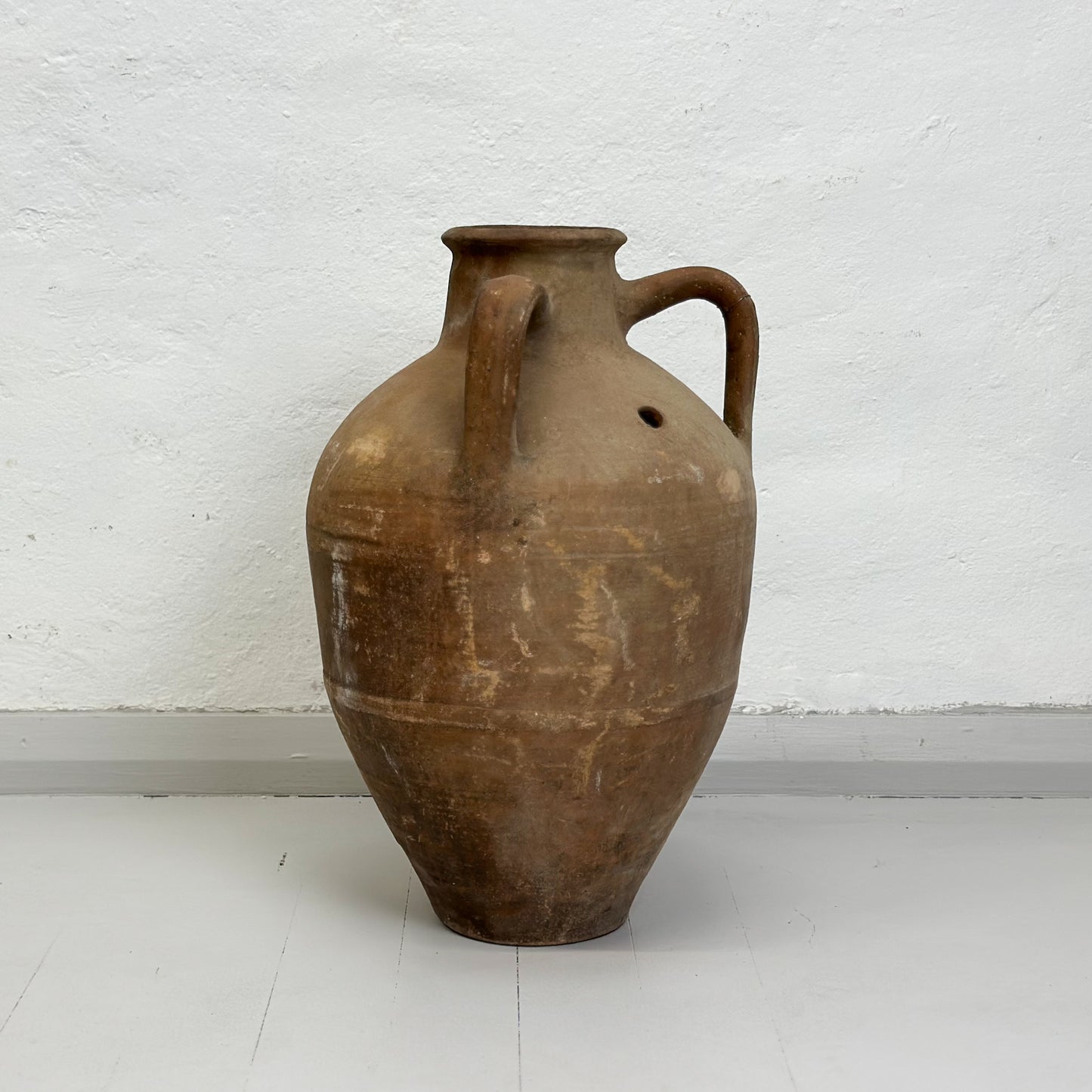 A brown ceramic Turkish milk churn pot with a handle, displayed against a white background.