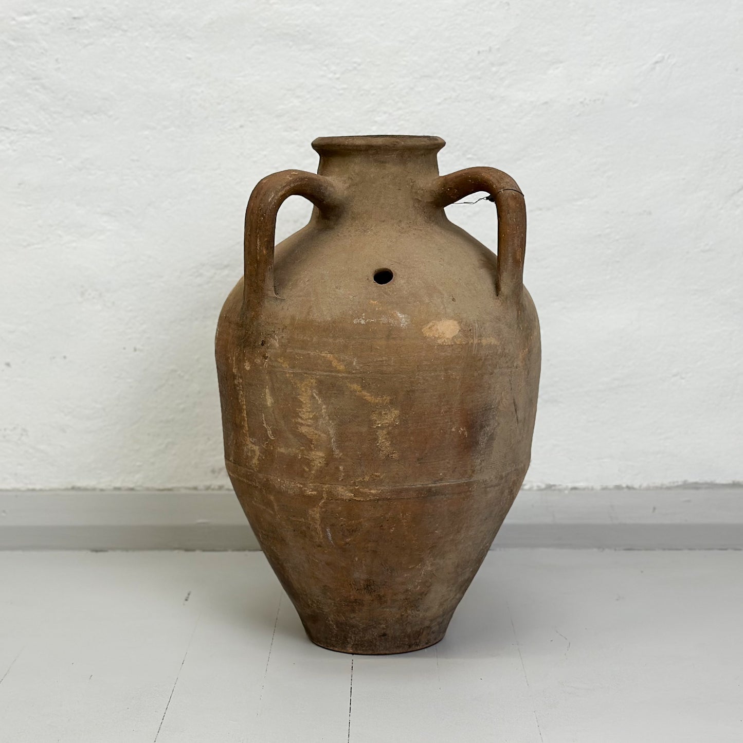 A brown ceramic Turkish milk churn pot with a handle, displayed against a white background.