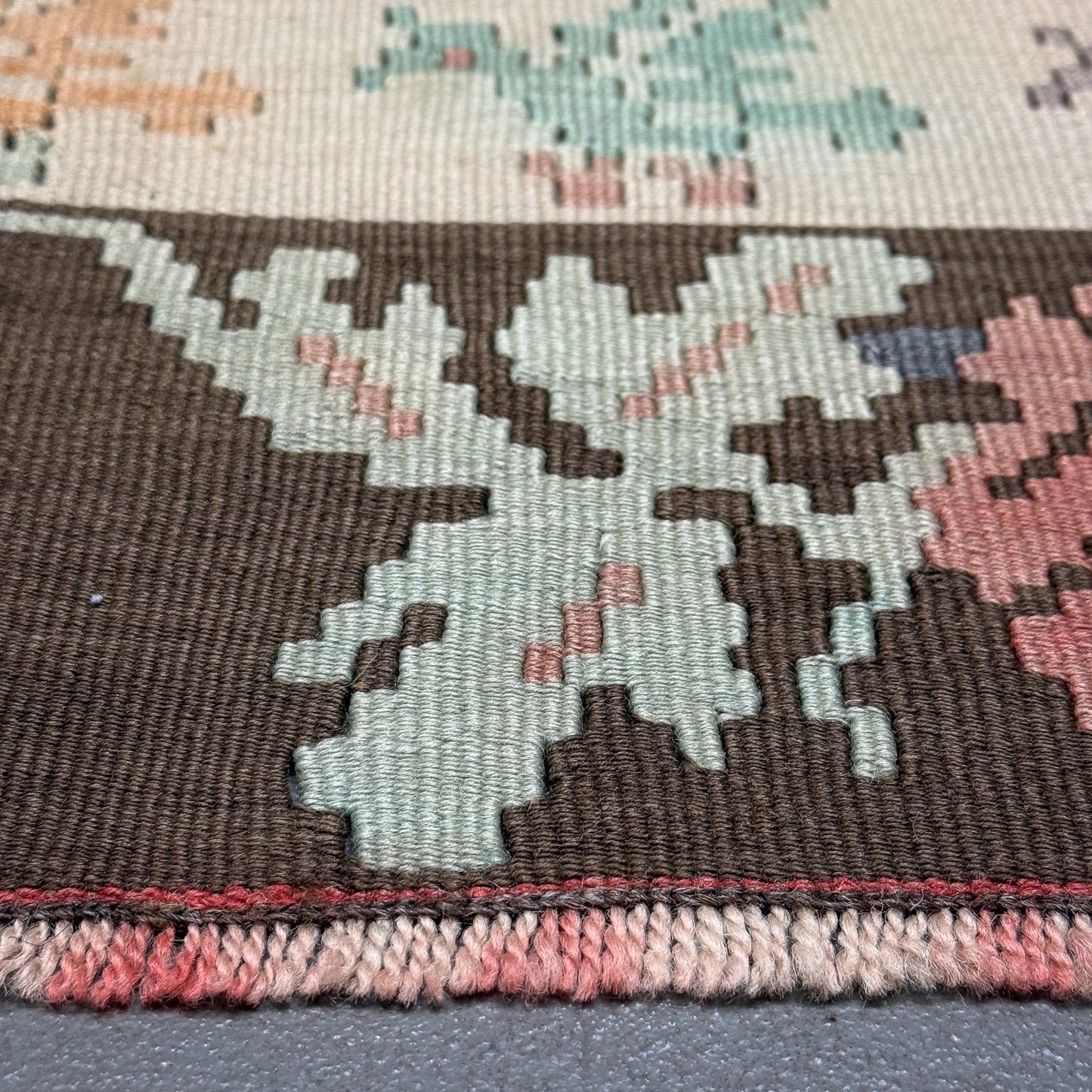 Close-up of a patterned rug with floral design