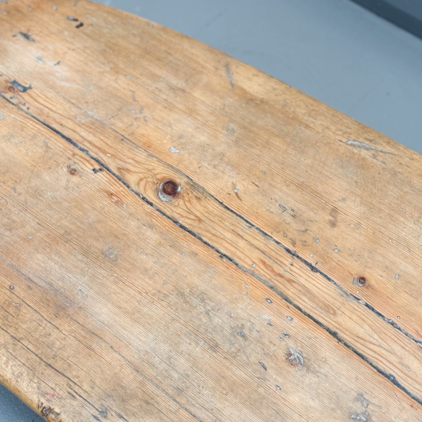 Close-up of a wooden surface with visible grain and texture